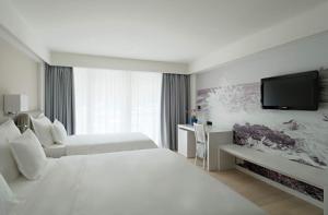 Postel nebo postele na pokoji v ubytování Hotel Osejava