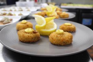 a plate with muffins with lemon slices on it at The Portaferry Hotel in Portaferry