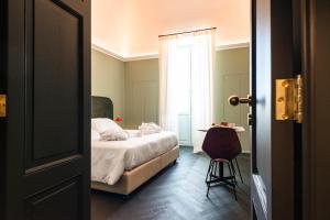 Postel nebo postele na pokoji v ubytování MoLo Suites