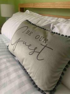 a pillow with the words eat our sleep at Rockhopper Cottage, Waldringfield in Woodbridge