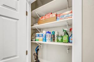 a pantry with cleaning products on shelves at Vista 2-Bedroom Apartment - Free Wifi - Near Beach in Vista
