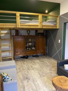 a living room with bunk beds and a couch at Apartament Wrocławska blisko zamku Książ in Wałbrzych