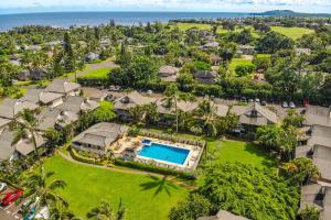 an aerial view of a resort with a swimming pool at Sandpiper #105b in Princeville