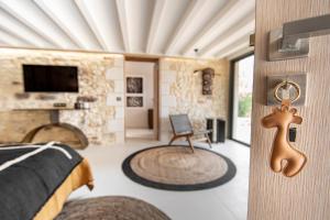 a bedroom with a room with a bed and a door at Hors-série en Périgord in Millac