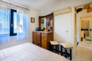 Postel nebo postele na pokoji v ubytování Villetta Duplex vista mozzafiato