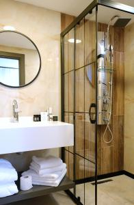 a bathroom with a sink and a shower at Casa De Port Hotel İstanbul in Istanbul
