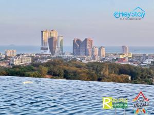 a view of a city from a body of water at The Apple Residence By Heystay Management in Melaka