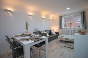 a living room with a table and a couch at Sealock Mews by Property Promise in Cardiff