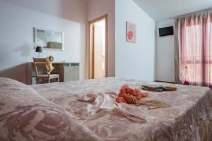 Posteľ alebo postele v izbe v ubytovaní B&B Pietre Preziose