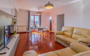 a living room with a couch and a table at Apartment Green Pula, Family friendly, Comfortable, free parking and WiFi in Pula