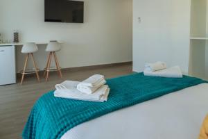 A bed or beds in a room at A&M CAVA