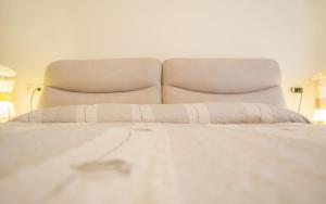 Un pat sau paturi într-o cameră la SmartStay - Stanze completamente arredate per il tuo soggiorno a Milano