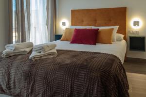 A bed or beds in a room at A&M CAVA