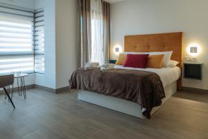 A bed or beds in a room at A&M CAVA