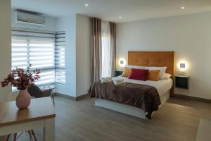 A bed or beds in a room at A&M CAVA