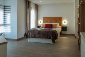 A bed or beds in a room at A&M CAVA