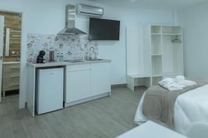 A bed or beds in a room at A&M CAVA