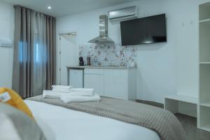 A bed or beds in a room at A&M CAVA