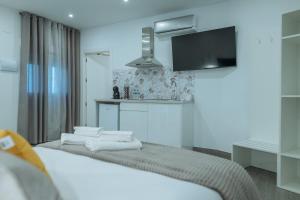 A bed or beds in a room at A&M CAVA