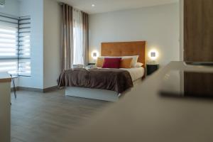 A bed or beds in a room at A&M CAVA
