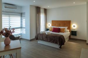 A bed or beds in a room at A&M CAVA