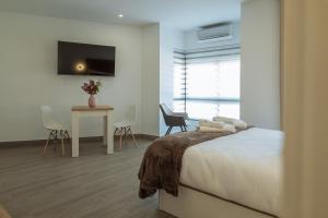 A bed or beds in a room at A&M CAVA
