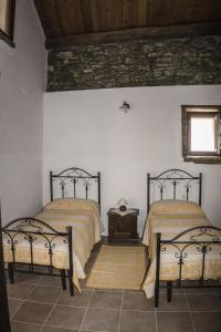 Letto o letti in una camera di Albergo Diffuso Il Mandorlo