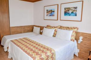 Cama ou camas em um quarto em Casarão Alpina
