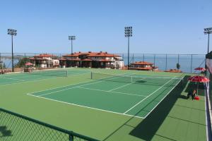 a tennis court with a tennis court at Eve Santa Marina Apartment II - sea, pools, relax in Sozopol