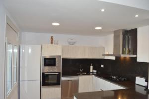 A kitchen or kitchenette at Casa Mar i Sol