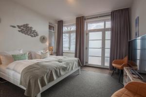 Letto o letti in una camera di AKZENT Strandhotels Seestern, Delphin & Lachs