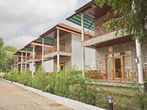 a house with balconies on the side of it at Wild Rose Resort and Spa in Pushkar