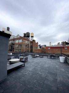 a group of benches sitting on top of a building at Modern Spacious Apartment in Chelsea in New York