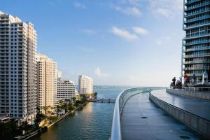 a bridge over a river in a city with buildings at Wonderful 2/2 Condo at Icon Brickell With Pool in Miami