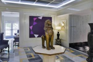 a statue of a lion on a table in a lobby at Wonderful 2/2 Condo at Icon Brickell With Pool in Miami