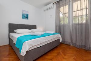 Postel nebo postele na pokoji v ubytování Apartment Zdravka