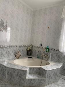 a bathroom with a large bath tub in a room at Al ladito de Sevilla in Bormujos
