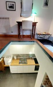 A bed or beds in a room at Casa del Moro - romantic loft in Trastevere