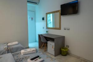 A television and/or entertainment centre at Santa Maria Accommodation