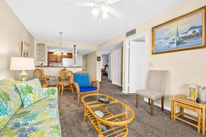 a living room with a couch and chairs and a table at 6206 Courtyard Villa 2nd Fl S in Saint Augustine