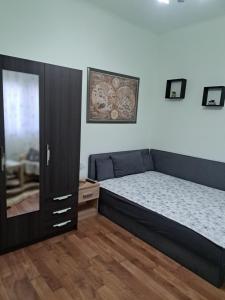 Postel nebo postele na pokoji v ubytování Manilla Vendégháza