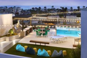 a rooftop patio with a table and chairs and a pool at Hillcrest 1br w gym wd pool nr bars shops SAN-9 in San Diego