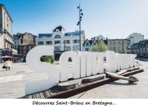 a large sign that says spartacus in a city at Tout confort à St Brieuc in Saint-Brieuc