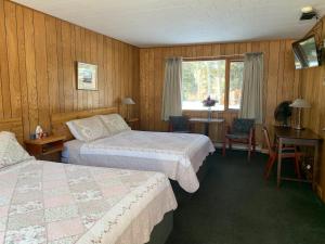 Letto o letti in una camera di Tete Jaune Lodge