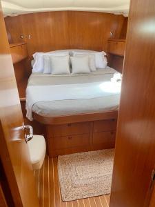 a small room with a bed on a boat at Jeanneau Sun Odyssey 54 DS LULU’ in Nydri
