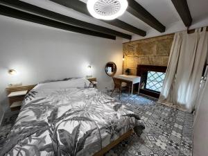 a bedroom with a bed and a fireplace at Paella flat old town Alicante in Alicante