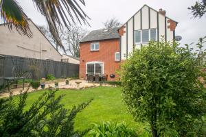 a house with a garden in front of it at Oceanside in Wyke Regis