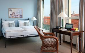 Katil atau katil-katil dalam bilik di Hotel Elbflorenz Dresden
