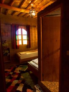 Katil atau katil-katil dalam bilik di Chambres dans casbah - Gite D'étape Gorges De Ziz