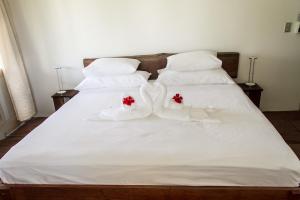 Giường trong phòng chung tại Hotel Horizontes de Montezuma